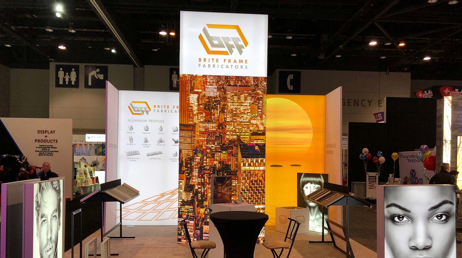 Brite Frame Fabricators exhibition booth with illuminated SEG walls