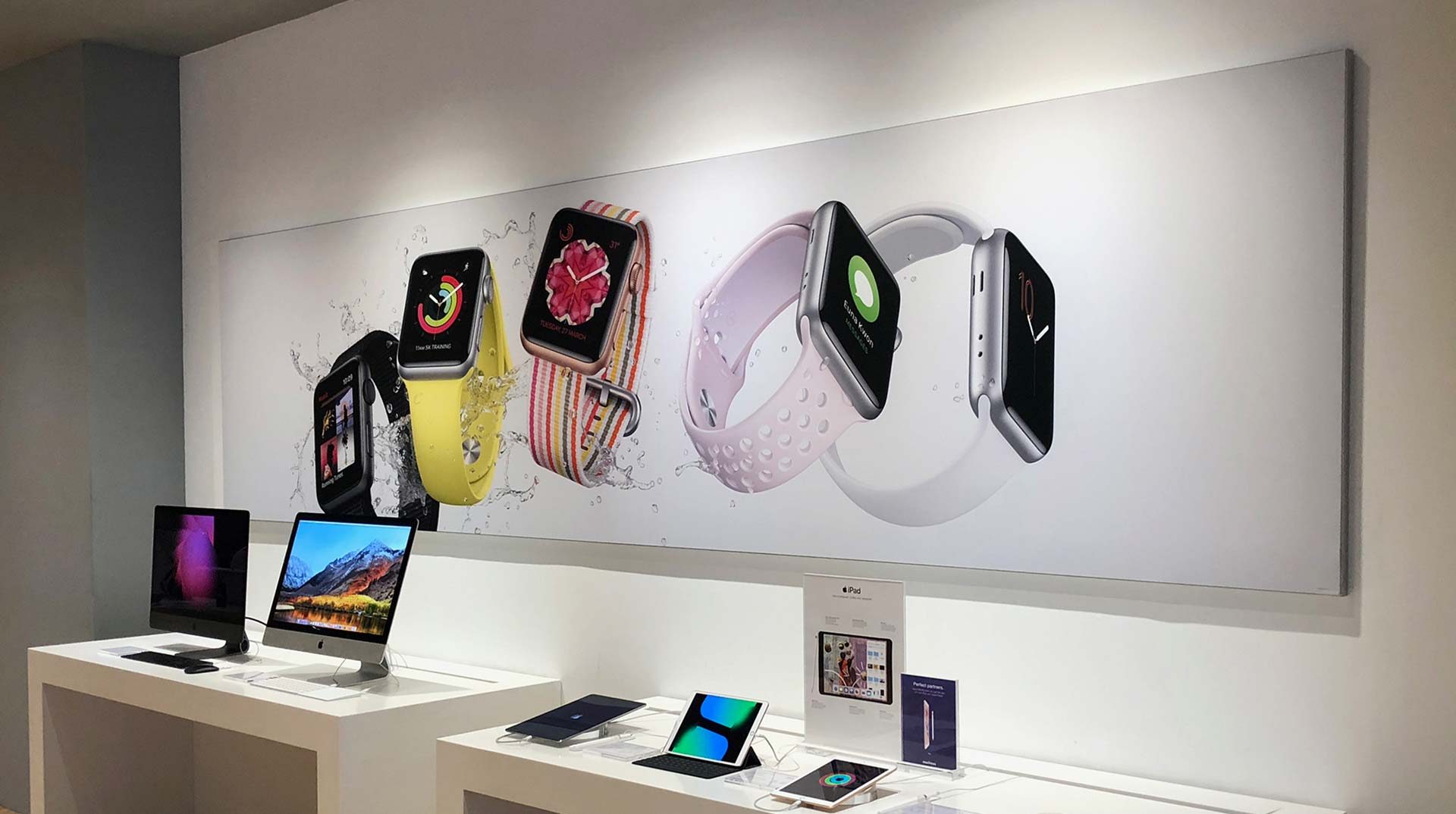 Long wall-mounted SEG lightbox in a retail interior