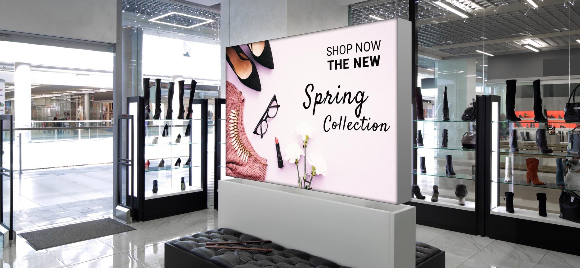 Freestanding double-face lightbox in a mall corridor