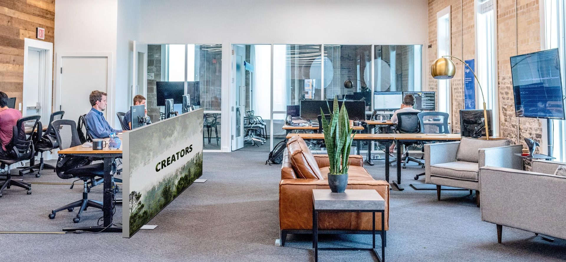 Desk-height lightbox partition in an open office
